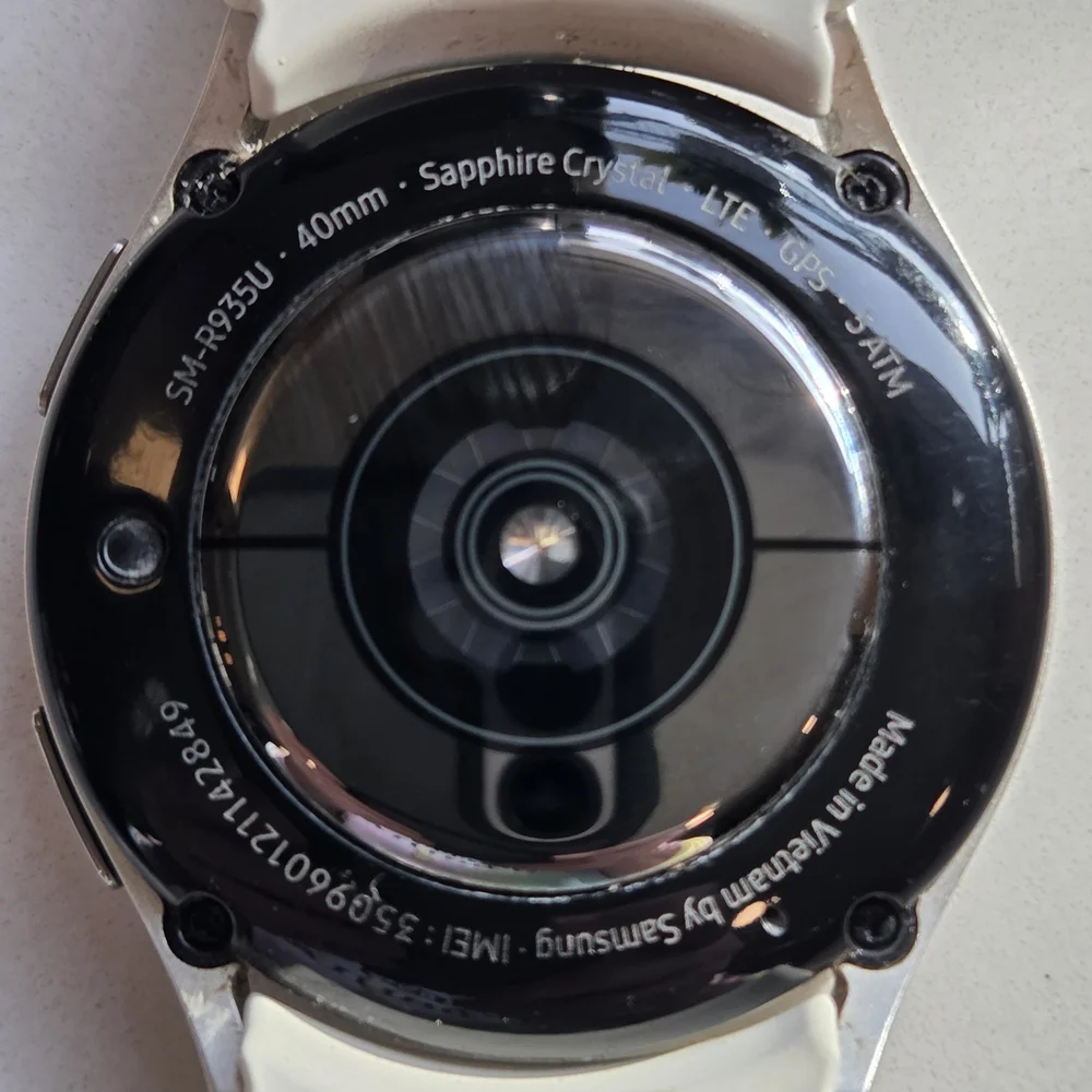 Versatile White Smartwatch with Multiple Bands